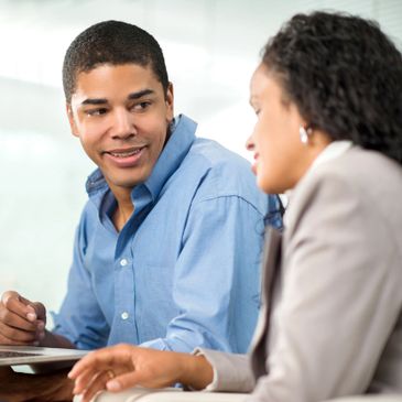 black males with mixed race female happy and discussing options for best immigration practices
