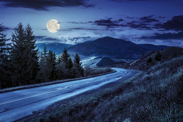 Night view with moon and blue sky with empty road
