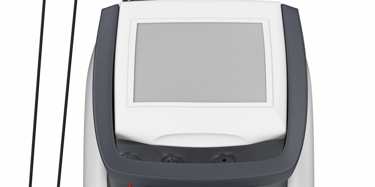 Close-up of a modern device with a blank screen and control buttons.