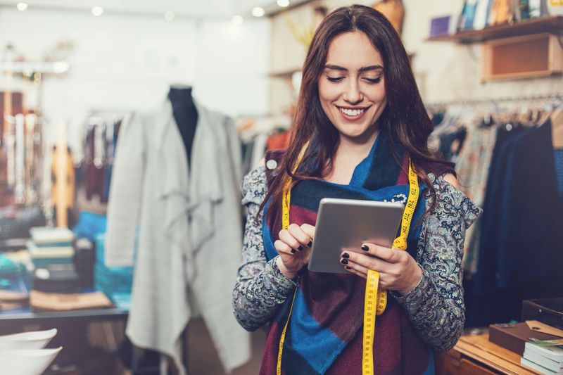 Manager with digital tablet in a fashion store