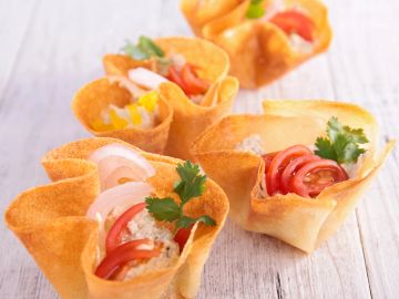 Colorful tortilla cups filled with fresh vegetables.