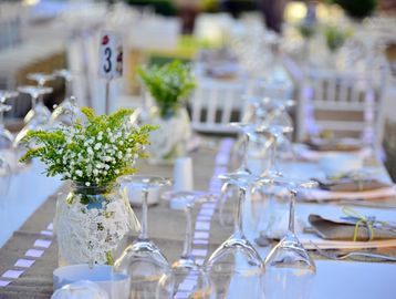 Elegant table setting with flowers at an event.