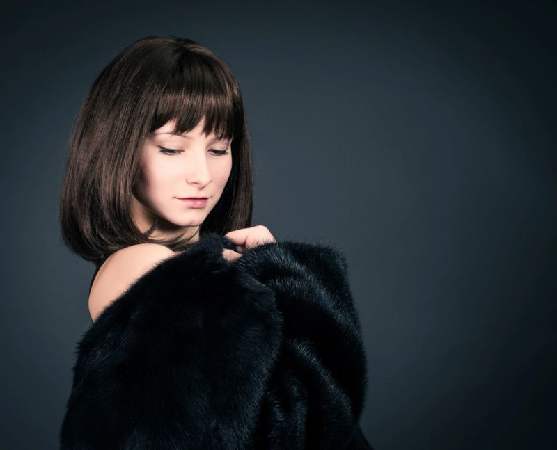 Beauty Fashion Model Girl in Mink Fur Coat. Beautiful Woman in Luxury Black Fur Jacket . Winter Fashion.
