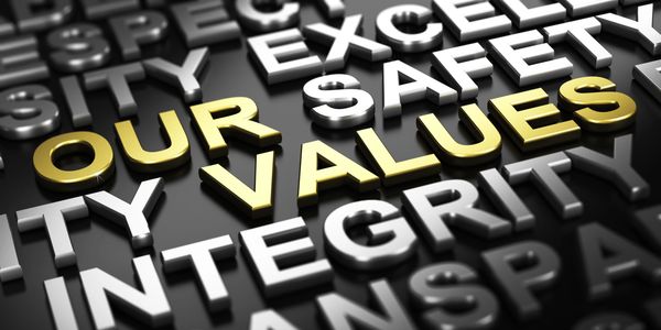 3D words highlighting 'Our Values' in gold among other white words.