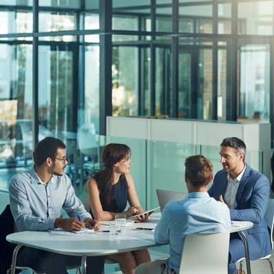 Team of business professionals having a meeting to ensure their suppliers are meeting Privacy Policy
