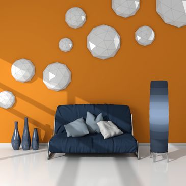 Modern living room with orange wall and geometric decor.