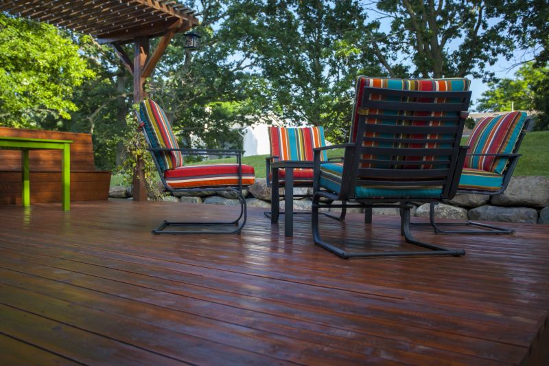 Stained wooden deck backyard view.