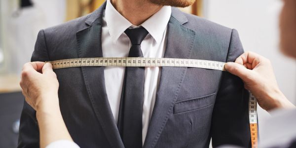 Man getting measured for a suit.