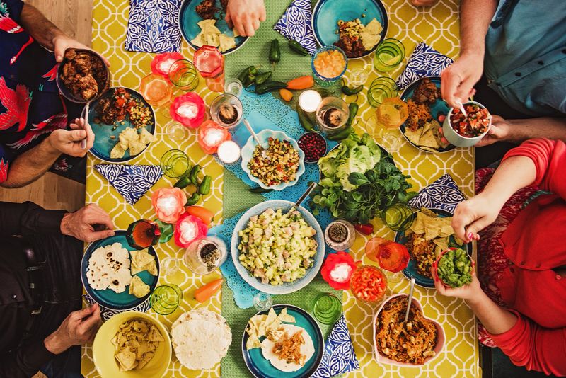 Friends having a Mexican tex mex dinner 
