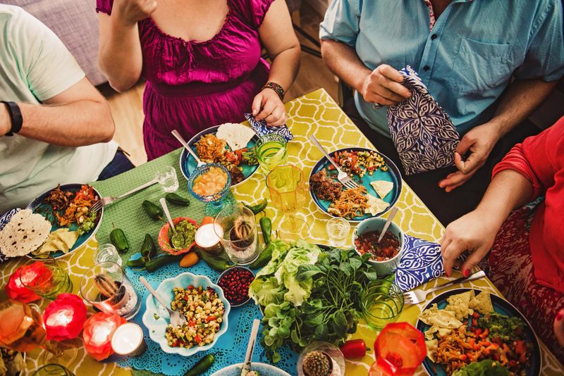 Friends having a Mexican tex mex dinner 