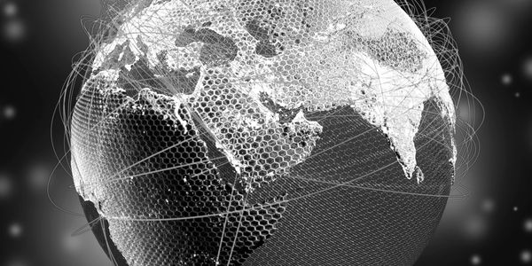 Digital globe with hexagonal mesh and network lines over Asia and Africa.