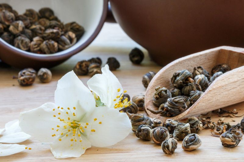 Green tea with Jasmine on a summer background. Shallow depth of field