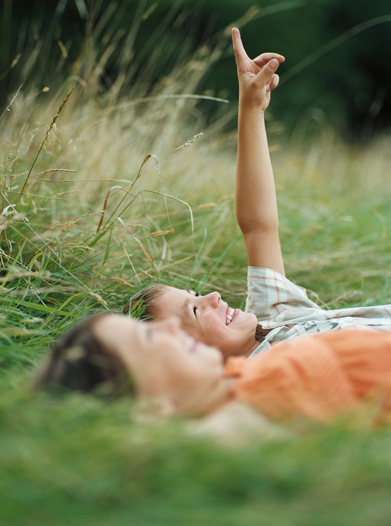 Boy and girl lying on the grass