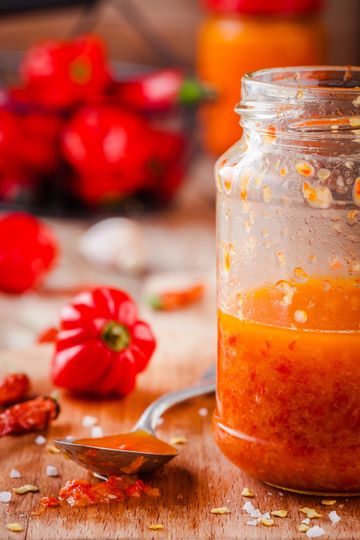 Jar of fermented habanero mash with garlic in honey