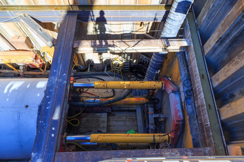A photograph of some concrete microtunneling pipes in an excavation pit. These pipes are three metres in diameter and were used for a microtunneling project in Switzerland.