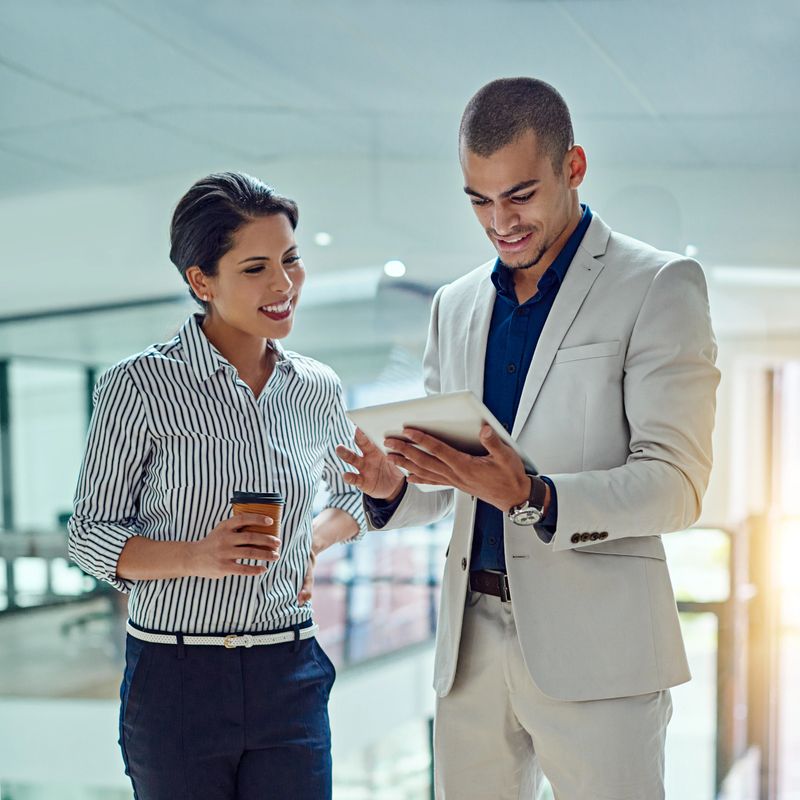 Cropped shot of two businesspeople working together on a digital tablet in an office