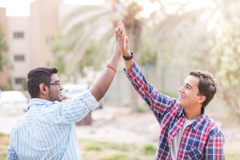 Two friends meeting after a long time.