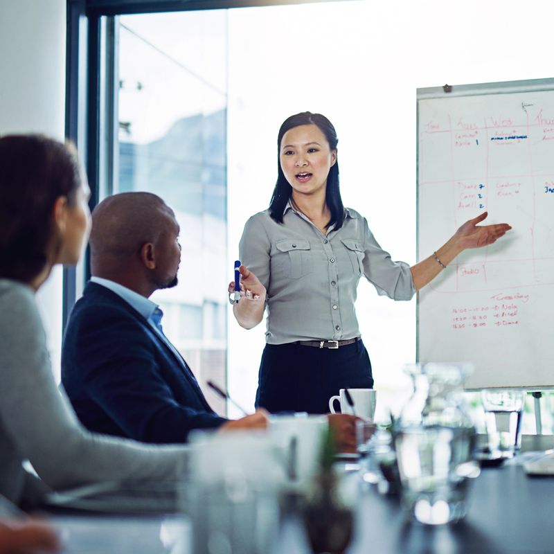 Shot of a businesswoman giving a presentation to coworkers in the boardroom