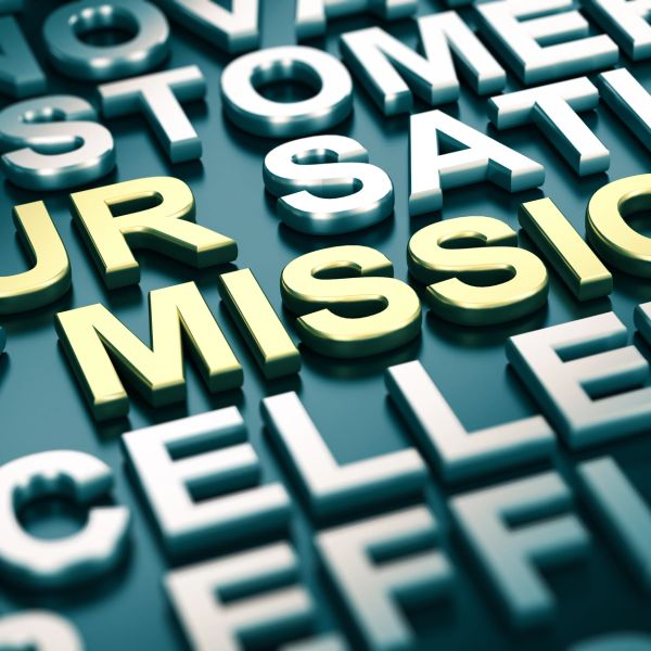 3D words highlighting 'MISSION' in focus among business terms.