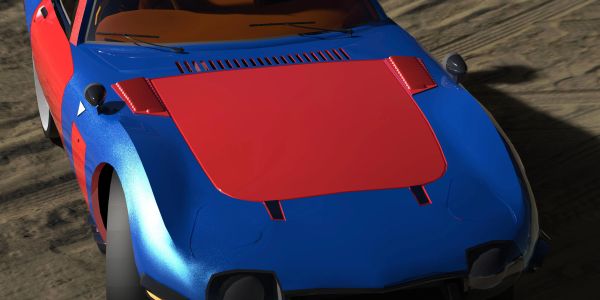 A blue and red sports car with a sleek design on a dirt surface.