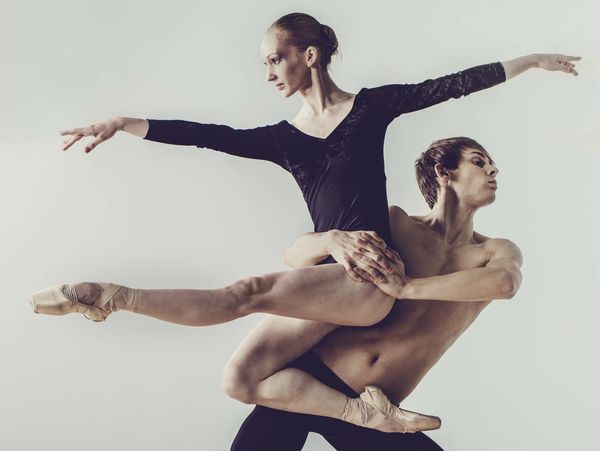 Male and female ballet dancers performing lift