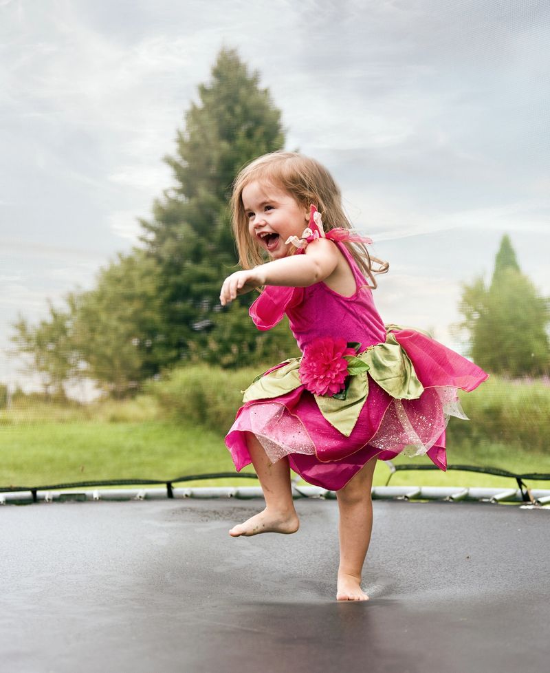 Little girl jumping on a trampoline