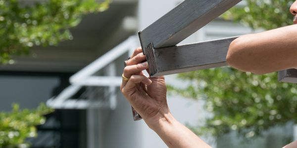 Folding arm awning arm adjustment by technician