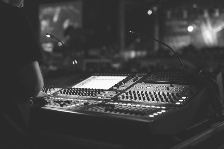 A large sound board with lights on it