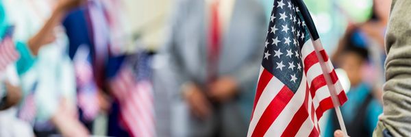 American flag held during a public gathering or event.
