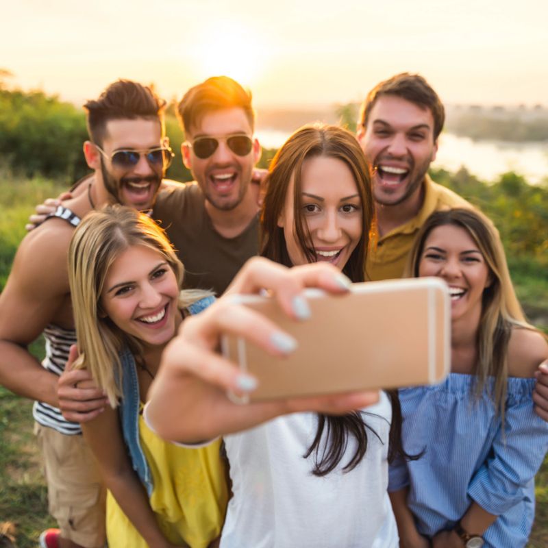 Happy friends making a crazy selfie together.
