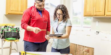Local handyman reviewing kitchen renovation and home repair plans in Los Gatos.