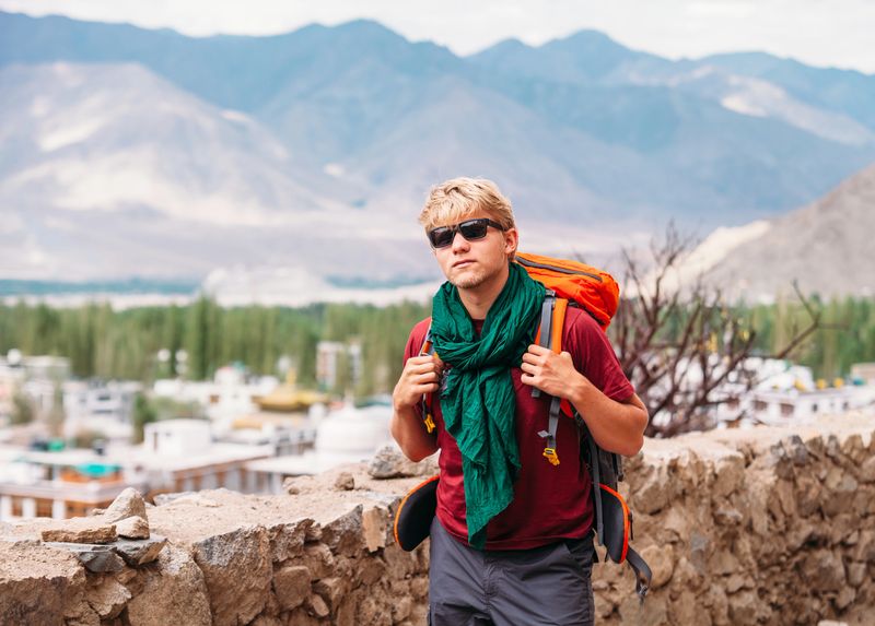 Backpacker tourist in tibetan settlement in Himalaya
