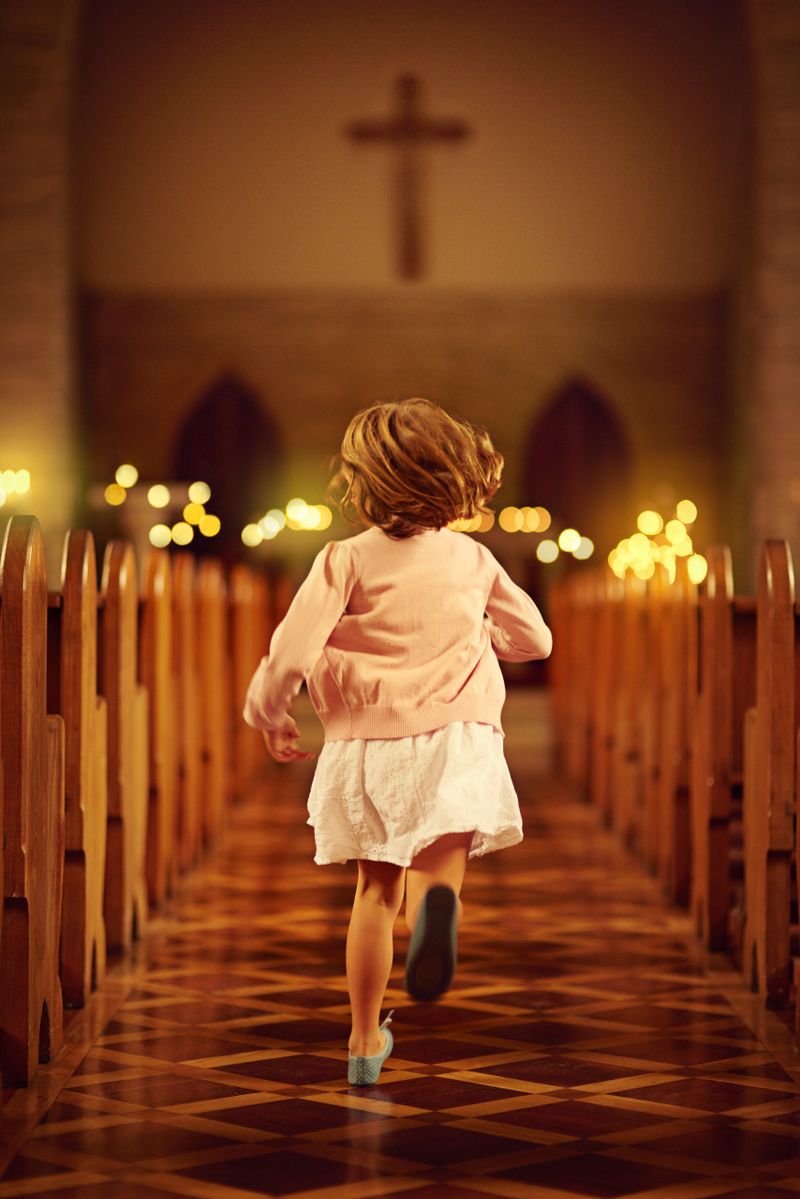 Cropped shot of a little girl running into an empty church