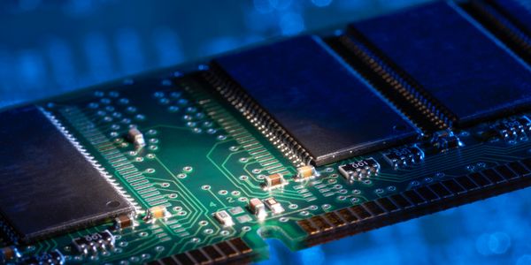 Close-up of a computer memory module with electronic components.