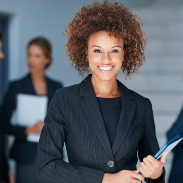Black businesswoman with business people in the background