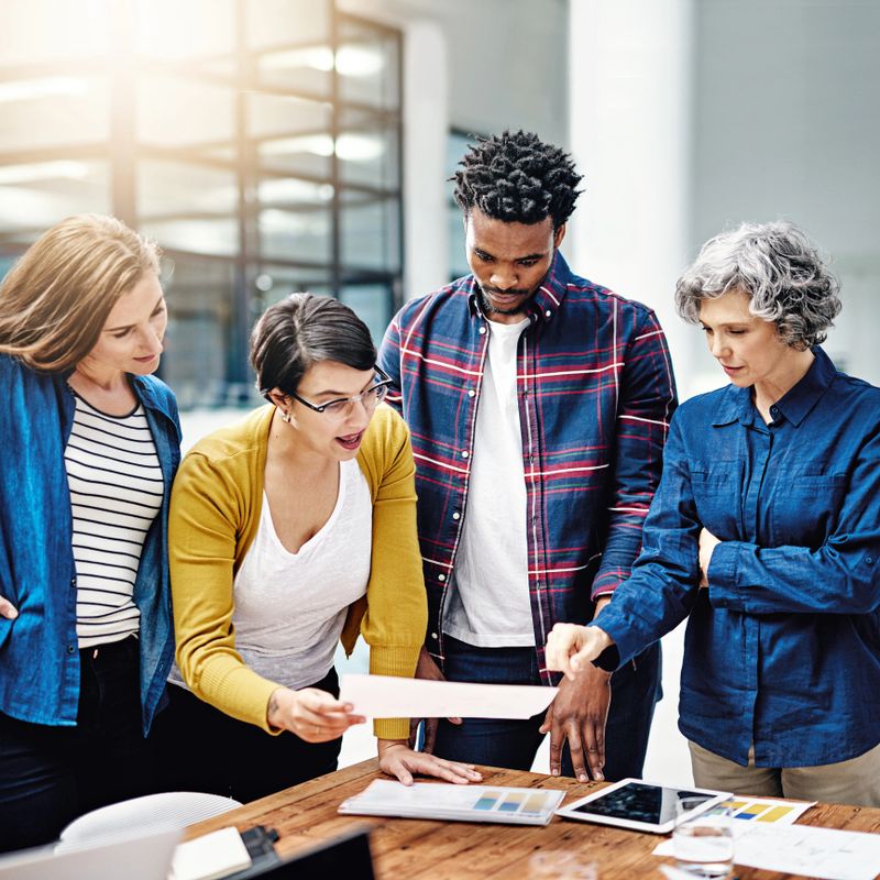 Cropped shot of a group of creatives having a meeting in a modern office