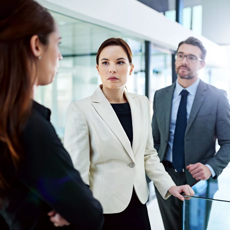 Cropped shot of a group of businesspeople having a serious discussion in the office