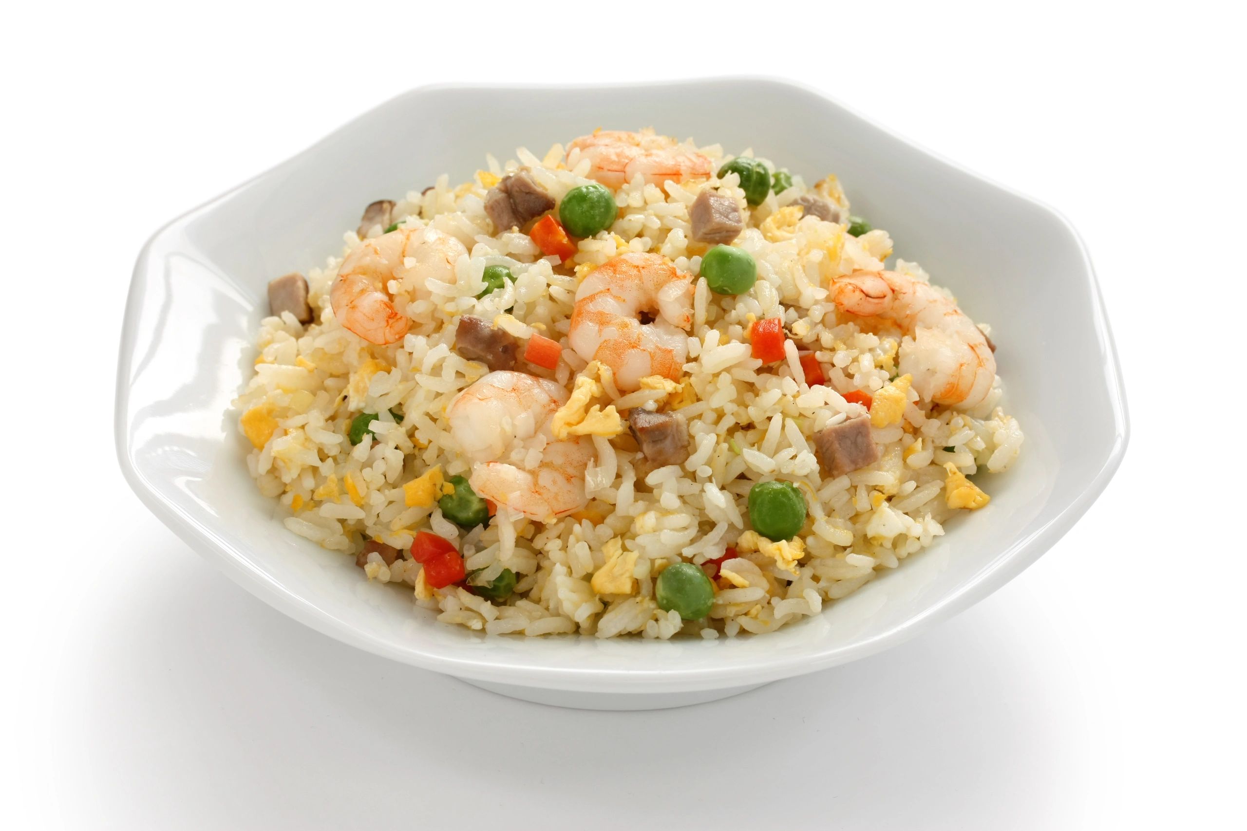 Shrimp fried rice with peas and diced meat.