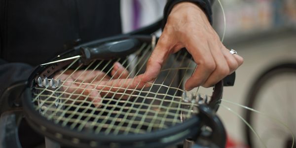 Stringing - - tennis racquet (racket) stringing services