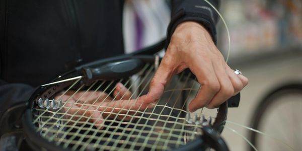 Stringing - - tennis racquet (racket) stringing services