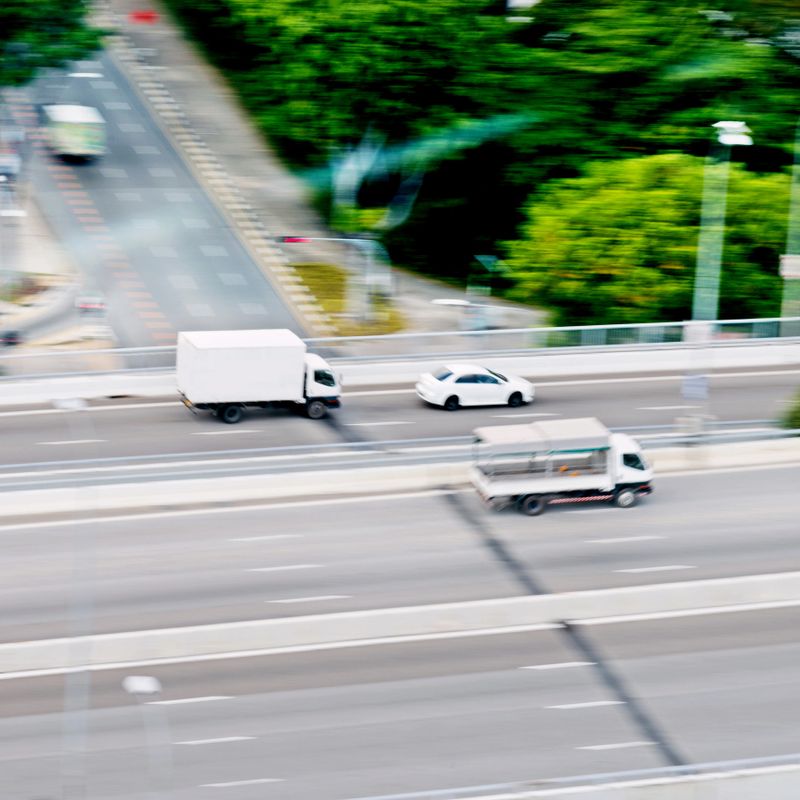 High angle view of delivery van in high speed on highway, blurred motion.