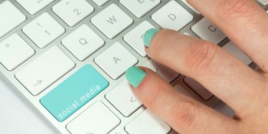 Fingers on a computer keyboard