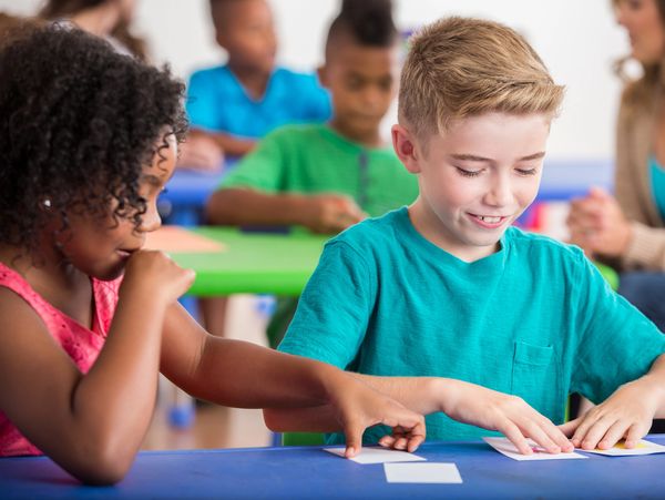 Children working on a classroom activity together.