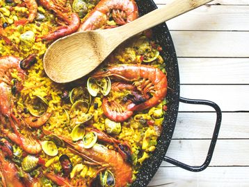Seafood paella with prawns and clams.