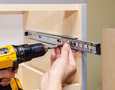 Furniture assembly expert at work
