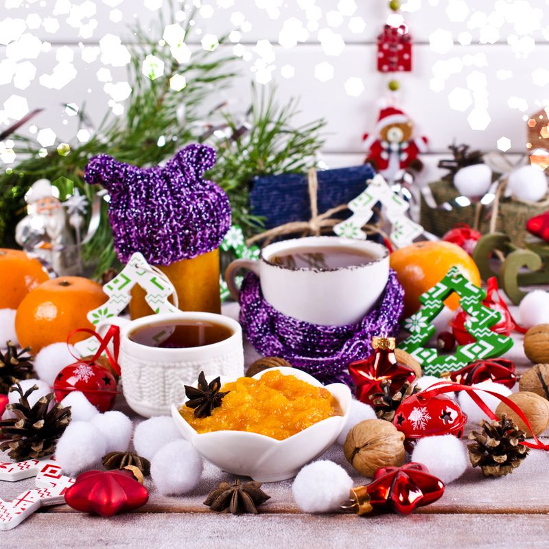 Jam of oranges on the background of Christmas entourage. Selective focus.