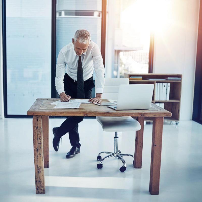 Shot of a businessman working at his desk in an office