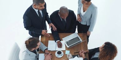 Business meeting with diverse professionals around a table.