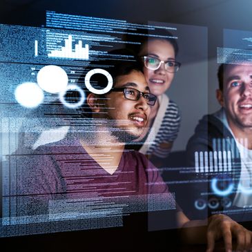 Three young professionals collaborating on data analysis with futuristic digital interfaces.