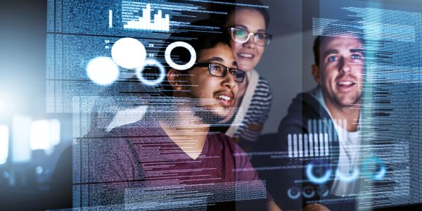 Three diverse colleagues analyze digital data on a transparent screen.